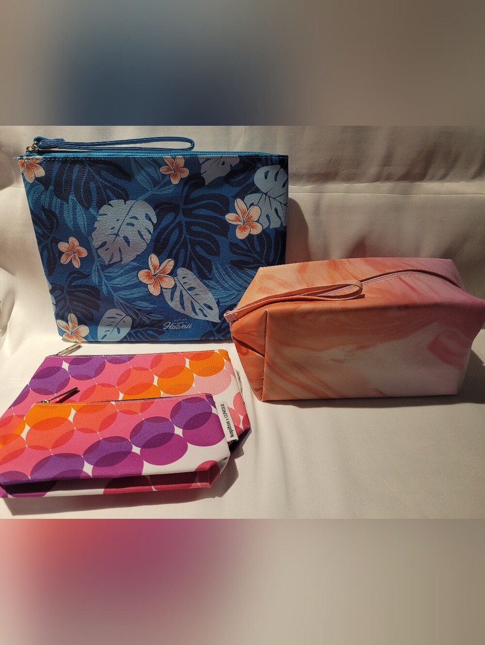 Clinique Set, Blue Hawaii, and Pink/Orange  Pouches.